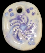 Handmade ceramic bear-track bead
