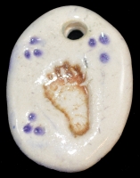 Handmade ceramic bear-track bead