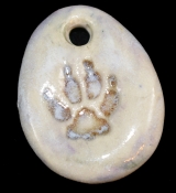 Handmade ceramic wolf-track bead