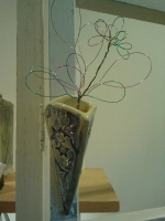 Wall vase with wire flowers